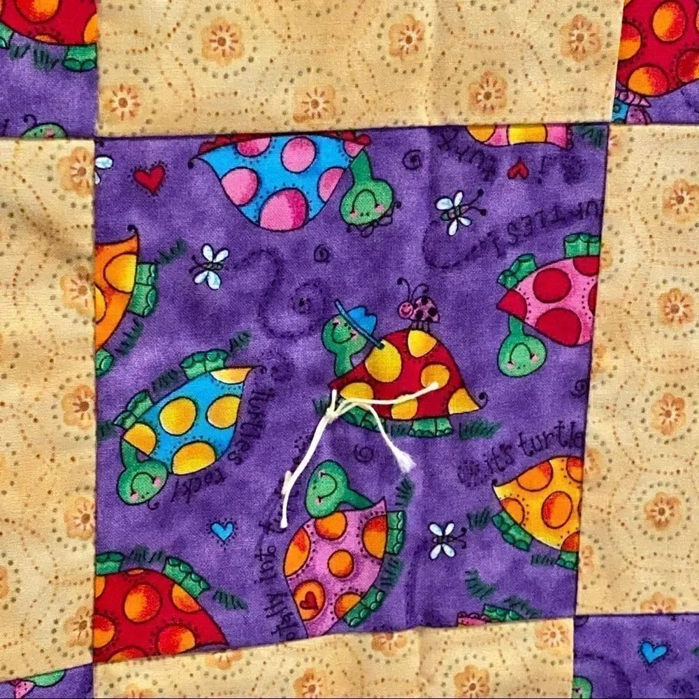 Handmade NWT turtle themed purple and gold baby or lap quilt size 43” X 38”